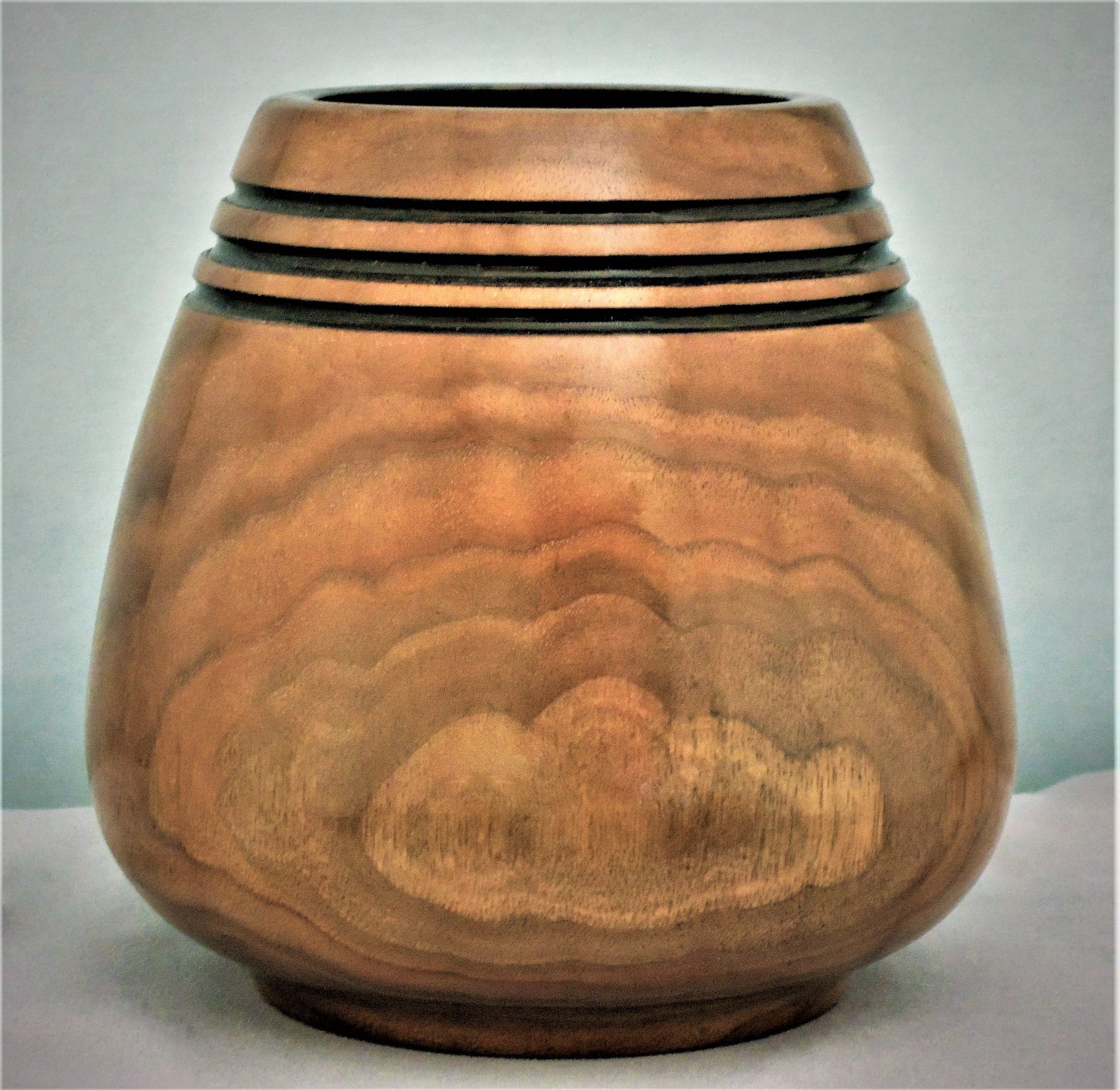 Made of Walnut 
8"H X 5"Dia   
Signed and #93